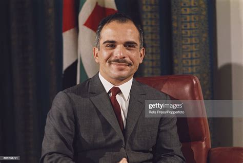 Portrait Of King Hussein Of Jordan Pictured Sitting At A Desk In