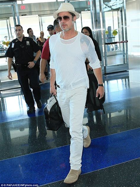 Brad Pitt Suffers Bandage Malfunction With Son Maddox Shopping In