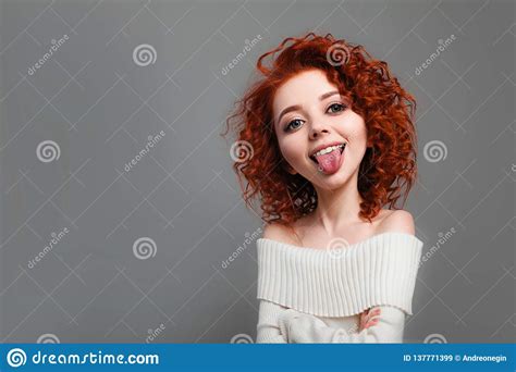 Funny Red Curly Girl With Big Head Shows Tongue Caricature Stylization