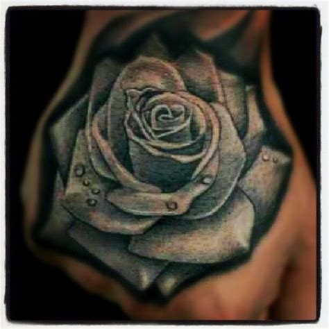 blue rose hand tattoo by lalo pena lalo pena s amazing artwork rose hand tattoo hand