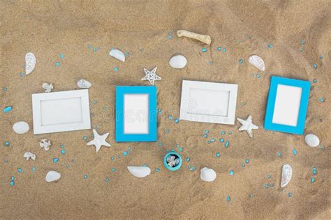 Four Blank Photo Frames On The Sand Beach With Decoration Stock Image