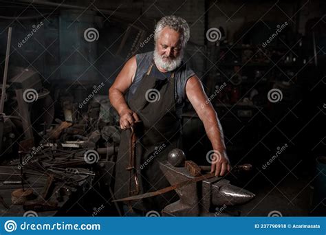 Blacksmith Preparing To Work Metal On Anvil Stock Photo Image Of