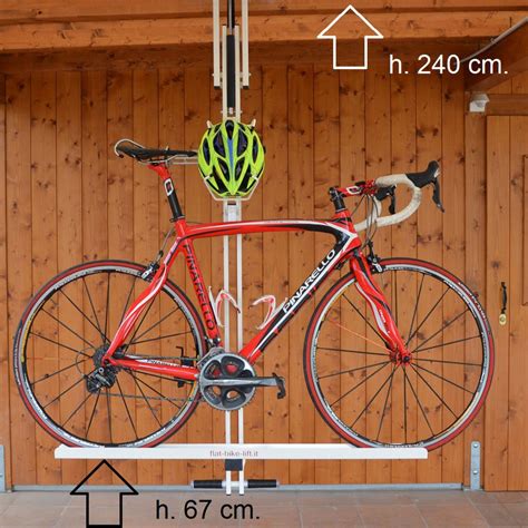 Bicycle hoisted and excess pulley rope attached to wall holder. flat-bike-lift: Ceiling Overhead Bike Rack, Ceiling Bike ...