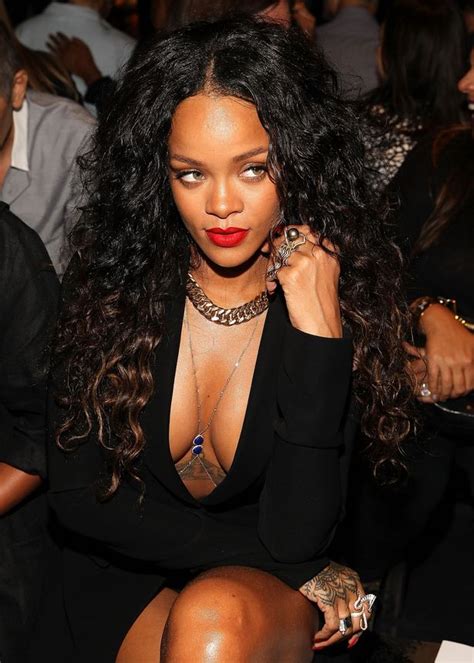 Rihanna Shows Off Serious Cleavage But Looks Like Misery On Night Out