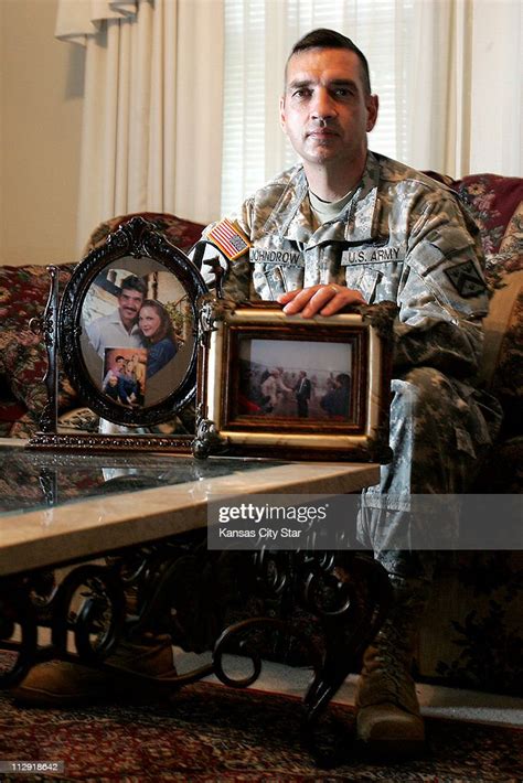 Command Sgt Maj Philip Johndrow Poses With Photos Of Him With His