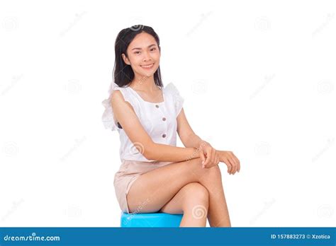 an asian girl in white sitting on blue stool bare feet stock image image of knee asian 157883273