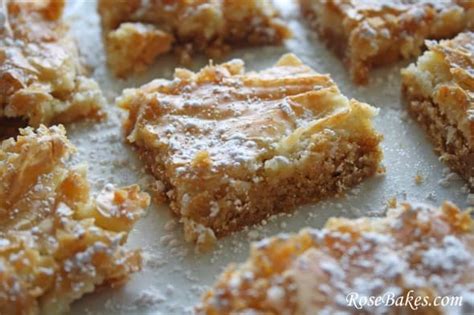 · ooey gooey butter cake bars ~ sweet vanilla cake is topped with a gooey cream cheese layer that's butterlicious. Gooey Butter Bars | Rose Bakes
