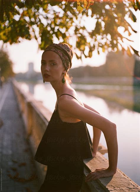 Portrait Of Beautiful Woman Posing Outdoors In Sunset Light Del