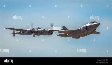 An F 38 Lightening And An F 35 Lightening Ii Fly Around The Airspace Of