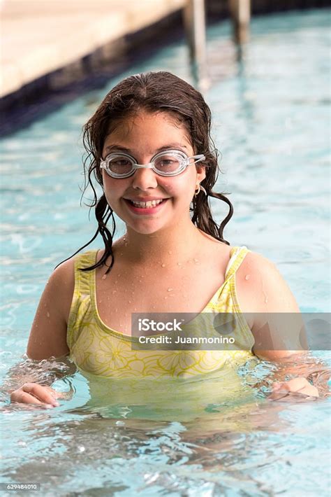 Twelve Years Old Hispanic Girl At The Swimming Pool Stock Photo