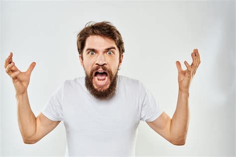 Premium Photo Young Bearded Man With Angry Gesture