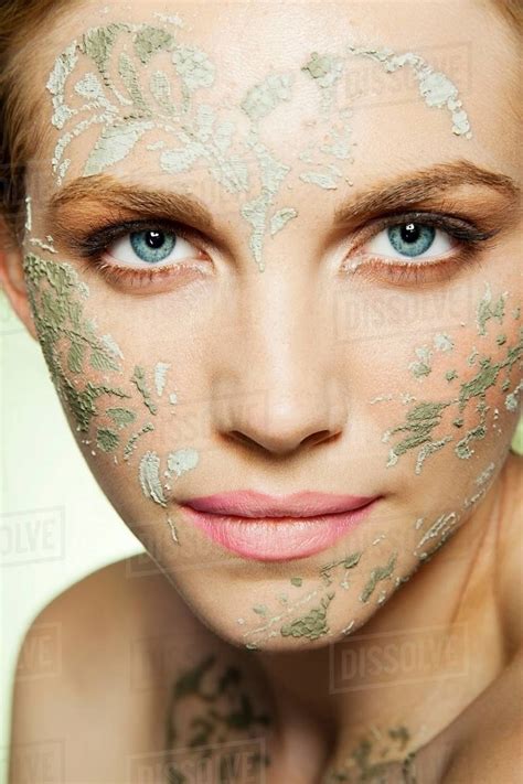 Womans Face Decorated With Face Mask Stock Photo Dissolve