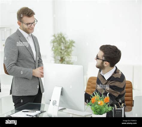 Manager Talking With An Employee In The Office Stock Photo Alamy