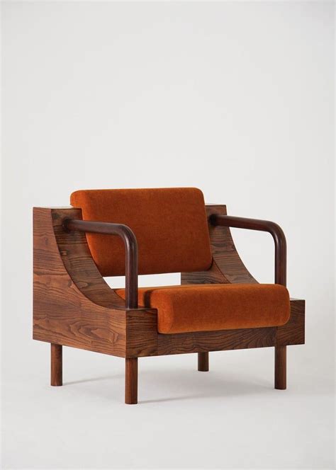 Created by christian rudolph, the rhodes tufted arm chair uses retro throwbacks to direct the details in the design, found in the tufted buttons and exposed top stitching. Modern Wooden Armchair from "Normative" Collection ...