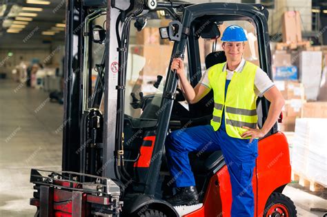 Premium Photo | Forklift driver in protective vest and forklift