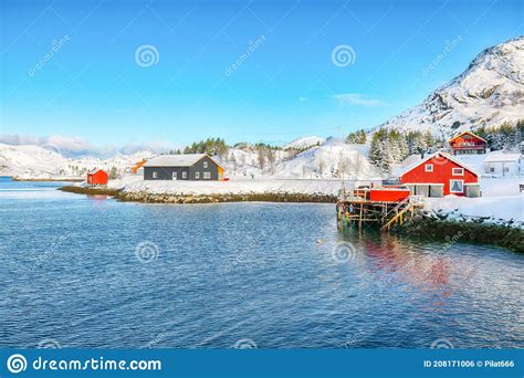 Traditional Norwegian Red Wooden Houses On The Shore Of Sundstraumen