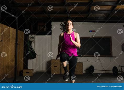 Young Woman Sprinting In A Gym Stock Photo Image Of Latin Dark 93591058