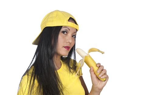 Asian Woman Eating A Banana Photograph By Joe Belanger
