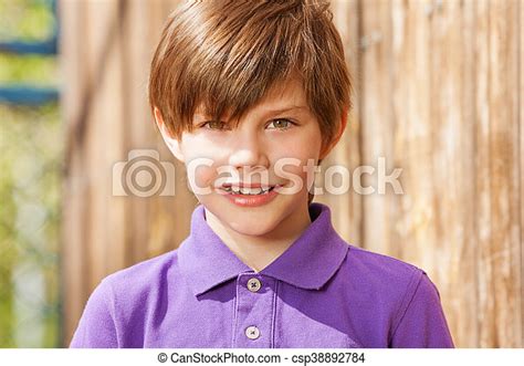 Portrait Of Ten Years Old Boy In Purple Shirt Close Up Portrait Of Ten
