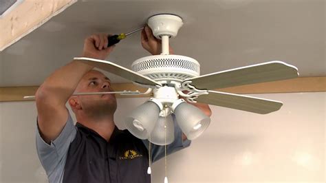 Set a sheet down on the ground underneath the ceiling fan, then place a step ladder on top of it. How to Replace a Ceiling Fan | Pt 1 | Curious.com