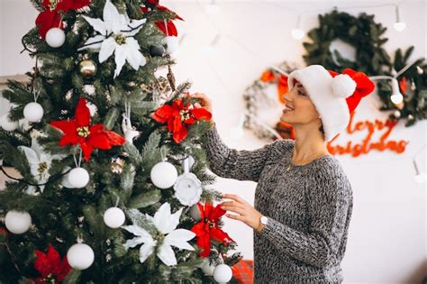 Free Photo Woman Decorating Christmas Tree