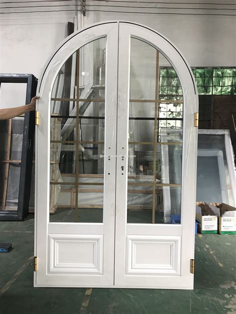 An Arched Glass Door In A Warehouse