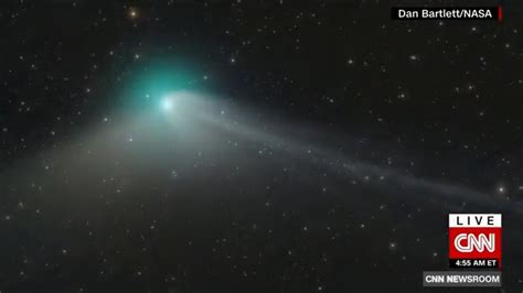 a recently discovered green comet will soon zip by earth for the first time in 50 000 years