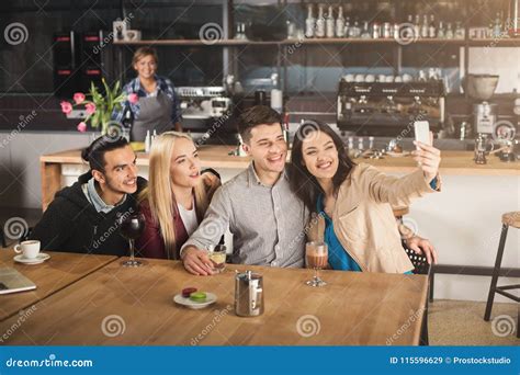 Happy Young Friends Drinking Coffee At Cafe Stock Image Image Of