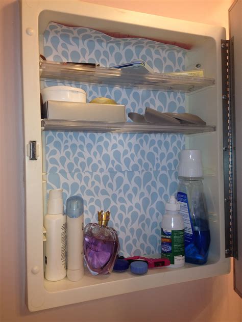 Scrapbook paper + medicine cabinet = pretty | Bathroom medicine cabinet, Medicine cabinet, Cabinet