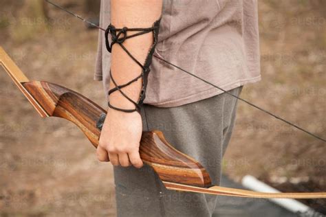 Image Of Close Up Of Teen Guy Holding Recurve Bow And Arrows Austockphoto