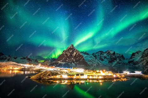 Premium Photo Aurora Borealis Over Mountains In Fishing Village At