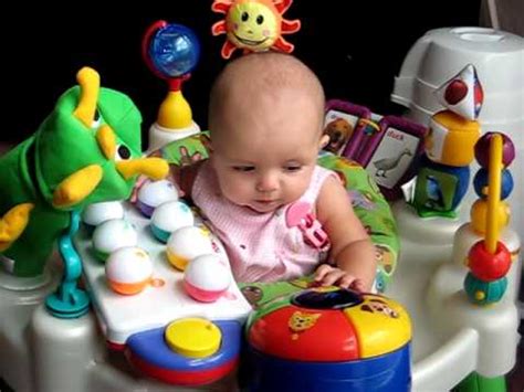 By now, your baby can use her hands and feet to play with a toy solo for a few minutes at a time. 4 month old baby playing with her toy - YouTube