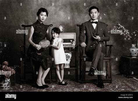 Classical style of a family of three photo Stock Photo - Alamy
