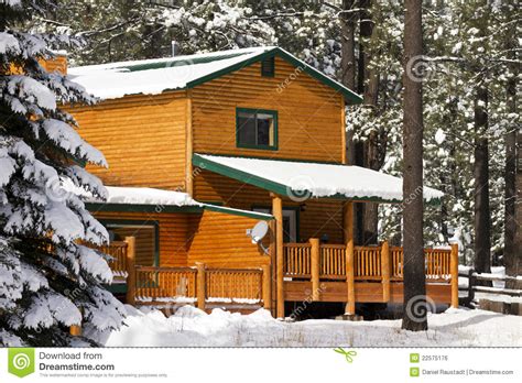 Modern Log Cabin Home In The Winter Woods Stock Photo