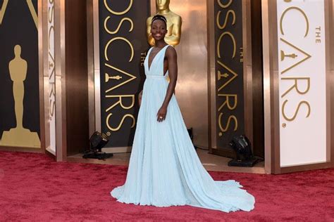 Lupita Nyongo Makes Her Oscars Red Carpet Debut In Light Blue Dress