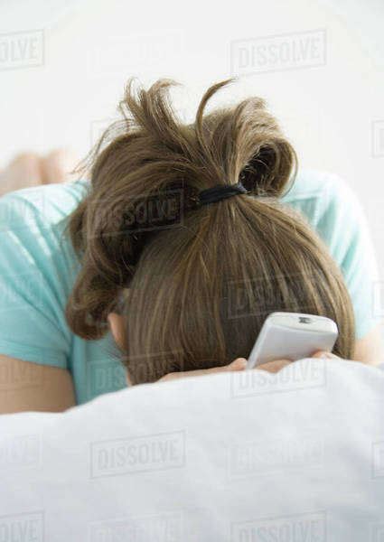 Preteen Girl Hiding Face In Pillow Stock Photo Dissolve
