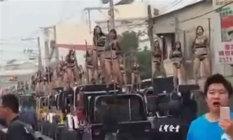 scantily clad ladies pole dance on top of jeeps for taiwanese official s funeral