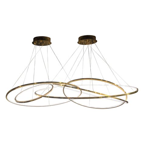 Crafted with exquisitely textured wood veneer, this stunning, curvilinear piece casts radiant, ethereal light that highlights the natural grain of the wood while softly diffusing into the room. LED Swirl Four Ring Chandelier Pendant Light in Gold Contemporary For Sale at 1stDibs