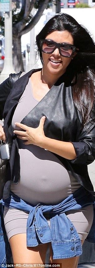 Kourtney Kardashian Struggles To Cover Up Her Bump Wearing Extremely Tight Dress Daily Mail Online