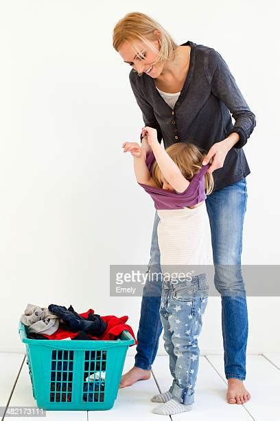 Girl Taking Off Shirt Bildbanksfoton Och Bilder Getty Images