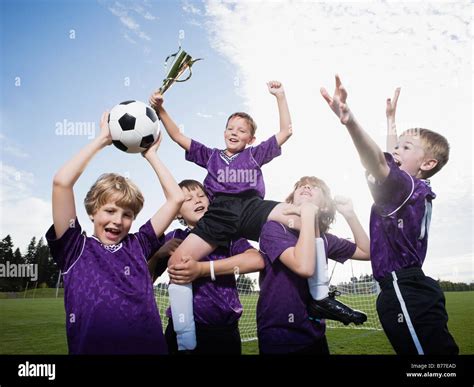Boys Soccer Team Celebrating Trophy Stock Photo Alamy