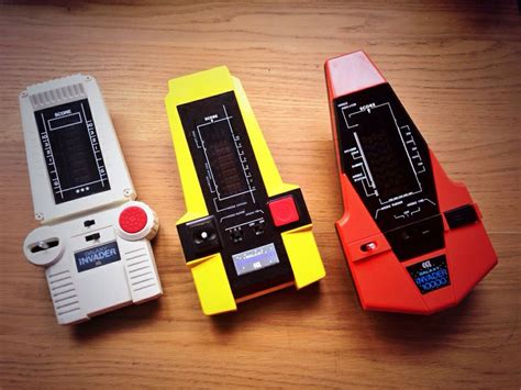 3 Generations Of Galaxy Invader Handheld Games With The Original 1000
