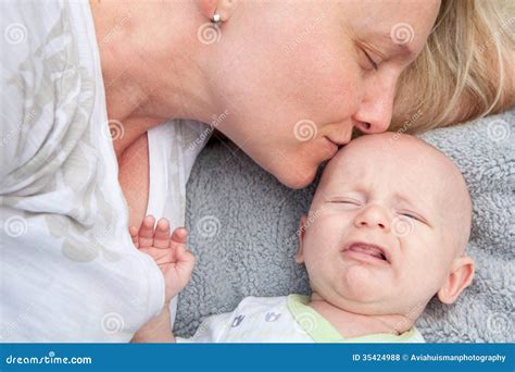 Mom Comforting Crying Baby Stock Photo Image Of Beautiful 35424988