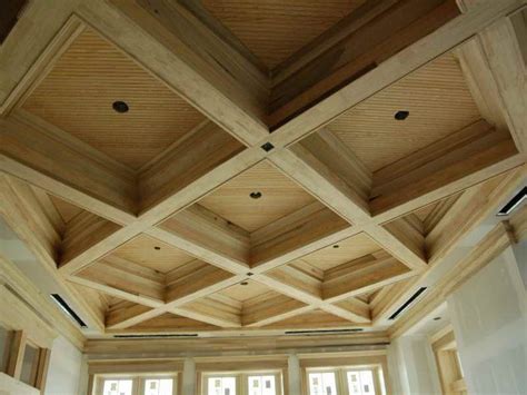 Faux wooden beams are attached to the ceiling, fanning out over the spacious kitchen island. Pin by Przemek Prem on Titan Construction Canada ...
