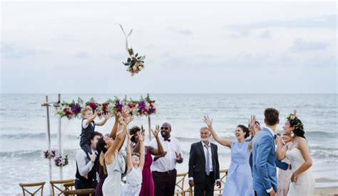 why do brides throw their wedding bouquet my white sand wedding