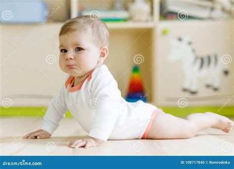 Cute Sad Crying Baby On Ground In Kids Room Stock Photo Image Of