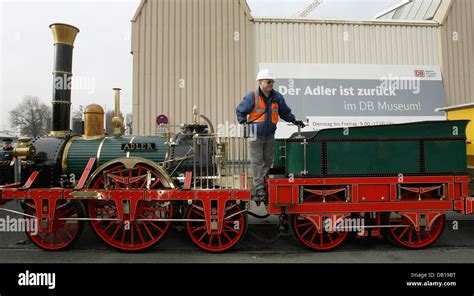 A Deutsche Bahn Employee Poses On The Restored Historical Replica Of