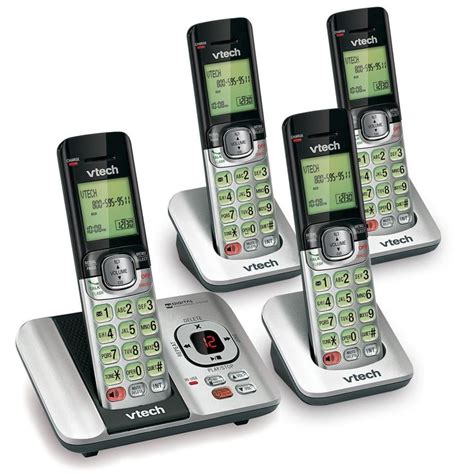Four Cordless Phones Sitting Next To Each Other