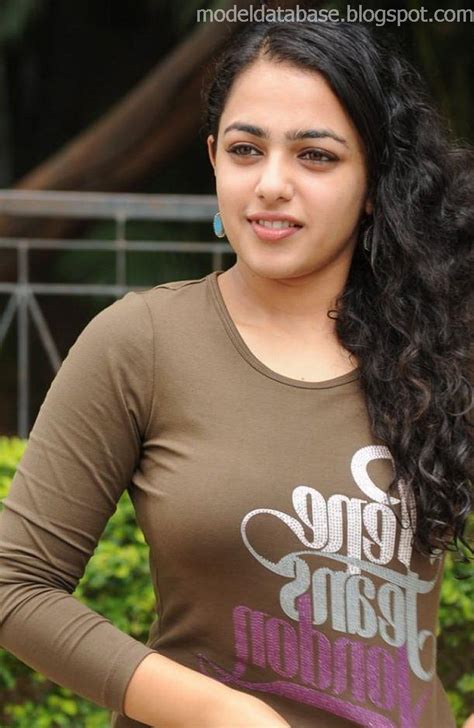 Indian Model Nithya Menon Photo Shoot In A Tight Shirt And Jeans Stills