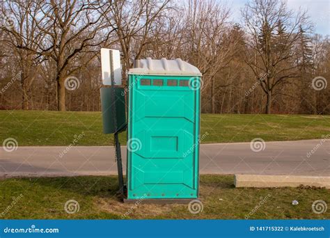 A Dirty Blue Portable Toilet In A Park Nasty Looking Place To Stock